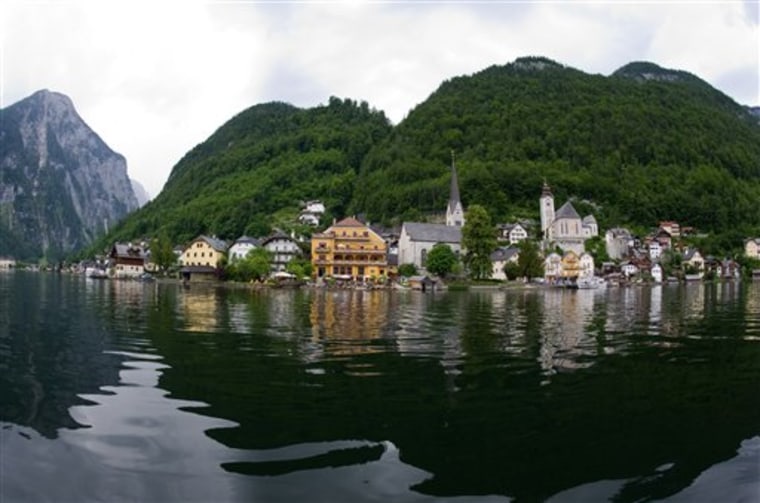 This photo taken on Thursday, June 16, 2011, shows the Upper Austrian town of Hallstadt. After taking photos and collecting other data on the village while mingling with the tourists, Chinese architects plan to rebuild Hallstatt in all topsy-turvy glory in far-away Guandong province - a project that residents here see with mixed emotions. 